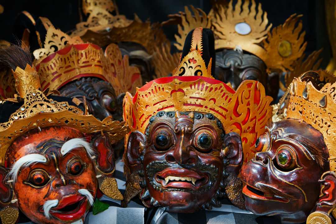Sacred tapel masks carved from blessed wood, central to the Wayang Wong performance and Balinese spiritual tradition.
