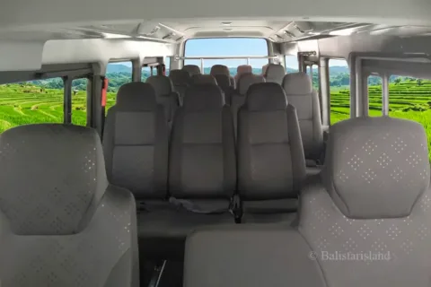 Elegant and spacious interior cabin setup of a Van 15 Seats Bali designed for comfortable group travel.