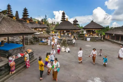 Besakih Temple complex with traditional shrines and Mount Agung rising in the background.