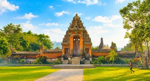 Majestic closed stone Candi Kurung gate providing entry to the innermost sacred court of Taman Ayun Temple.