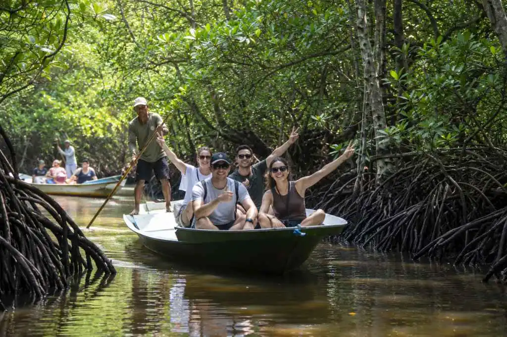 Travelers enjoying a traditional boat ride through Nusa Lembongan mangroves