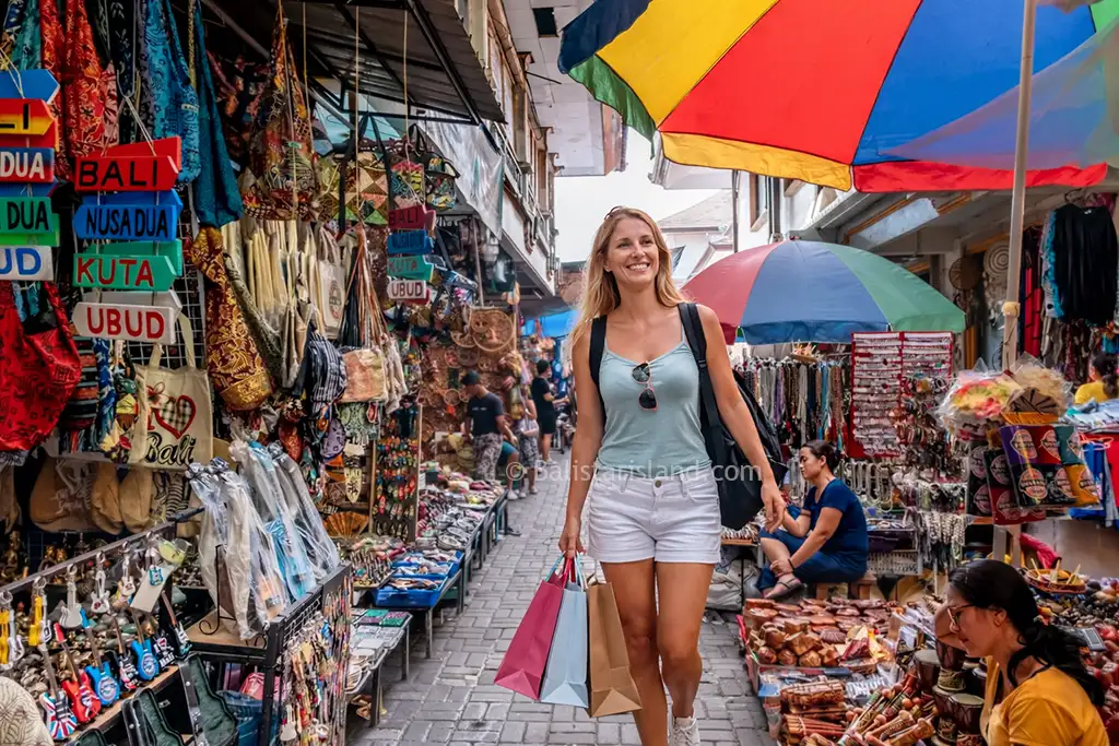 Tourists walking through the clean central walkways of Ubud Art Market in the heart of Ubud, Bali.
