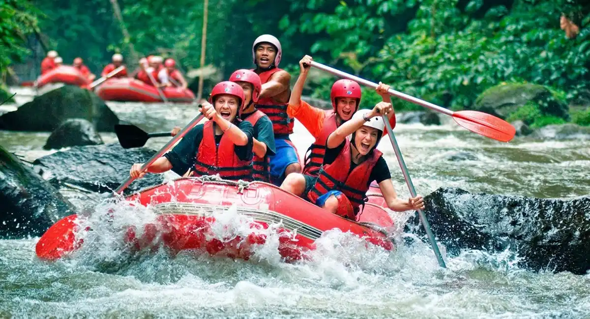 Tourists navigating exciting rapids during an Ayung River Rafting adventure in Bali