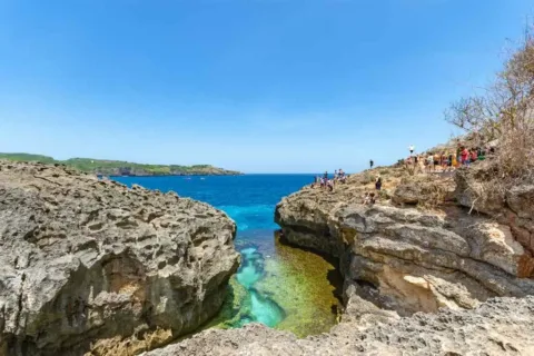 Angel's Billabong natural rock pool surrounded by rugged coastal cliffs in Nusa Penida