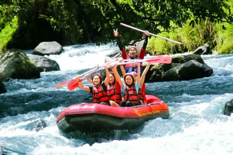Family enjoying a guided Ayung River Rafting experience in Ubud, Bali