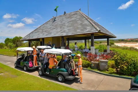 Golf caddies ready to assist golfers at New Kuta Golf in Pecatu, Bali