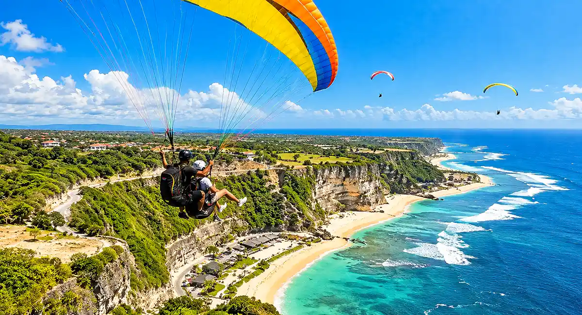 Paragliding adventure above the cliffs and ocean of Uluwatu, Bali