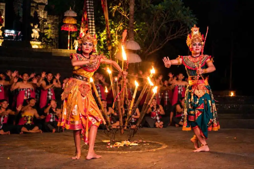 Balinese dancers performing a traditional Kecak dance at night