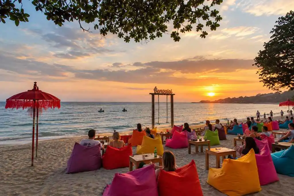 Colorful bean bags and beachfront seating at sunset during a Bali Lombok 9 Days Package