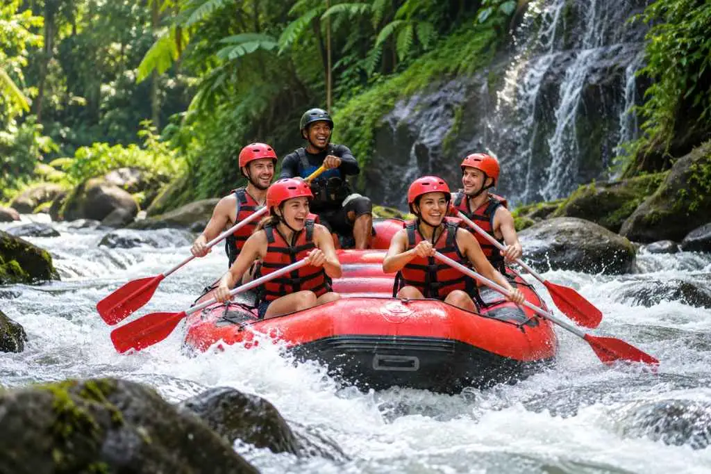 Ubud Rafting Tour with four adult guests and a local guide paddling through white-water rapids in Bali’s lush tropical jungle.